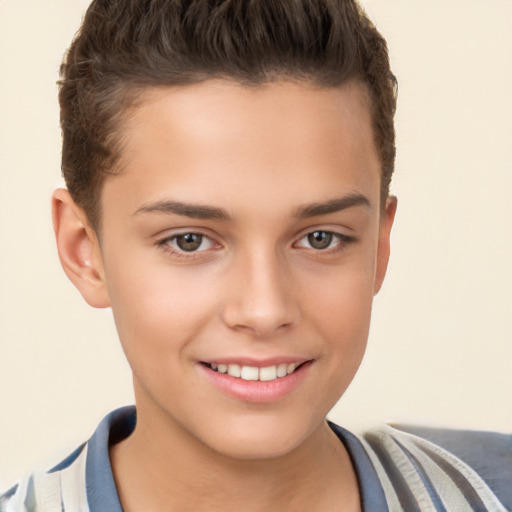 Joyful white child male with short  brown hair and brown eyes