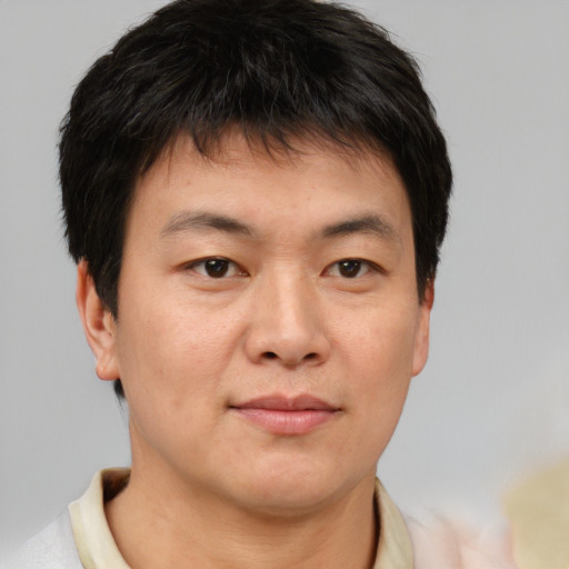Neutral asian young-adult male with short  brown hair and brown eyes