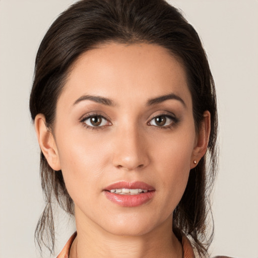 Joyful white young-adult female with long  brown hair and brown eyes