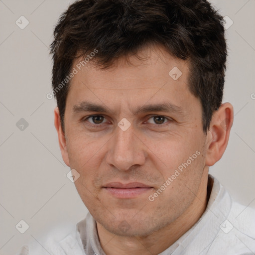 Joyful white adult male with short  brown hair and brown eyes