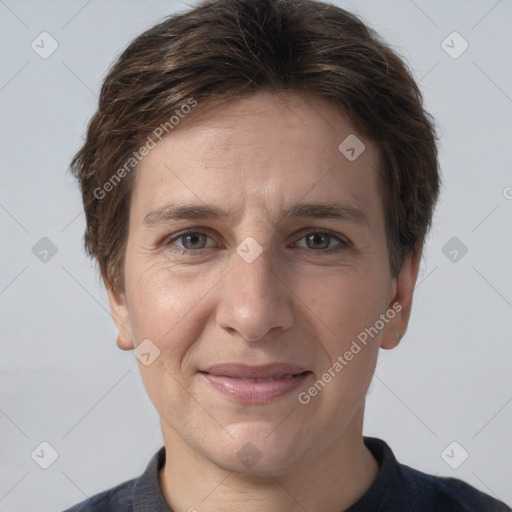 Joyful white adult female with short  brown hair and grey eyes