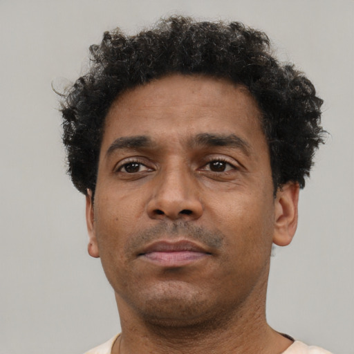 Neutral black adult male with short  black hair and brown eyes