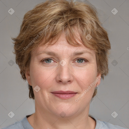 Joyful white adult female with medium  brown hair and blue eyes