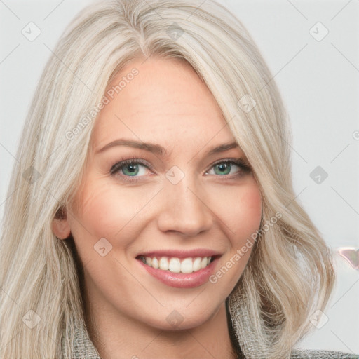 Joyful white young-adult female with long  blond hair and blue eyes