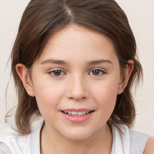 Joyful white child female with medium  brown hair and brown eyes