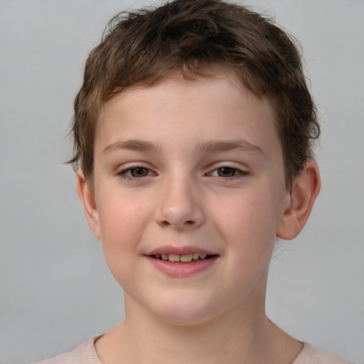 Joyful white child male with short  brown hair and brown eyes