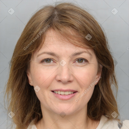 Joyful white adult female with medium  brown hair and grey eyes