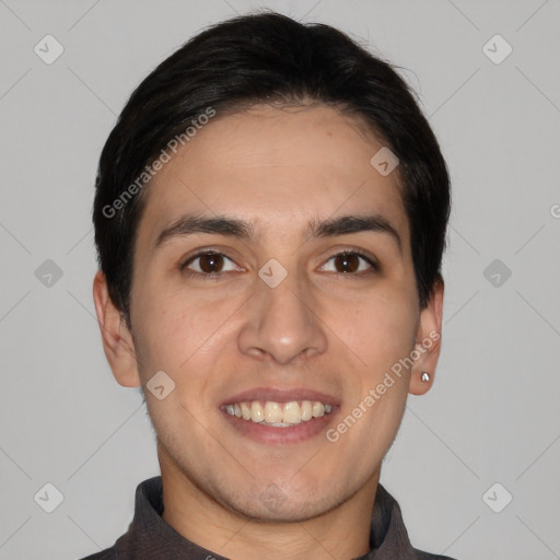 Joyful white young-adult male with short  black hair and brown eyes