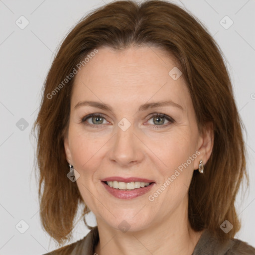 Joyful white adult female with medium  brown hair and grey eyes