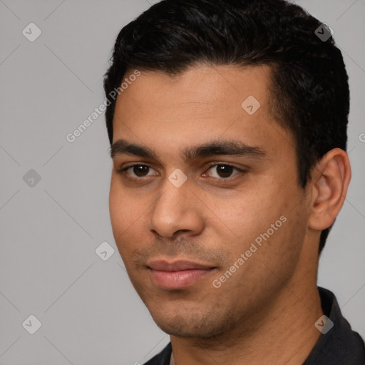 Neutral white young-adult male with short  black hair and brown eyes