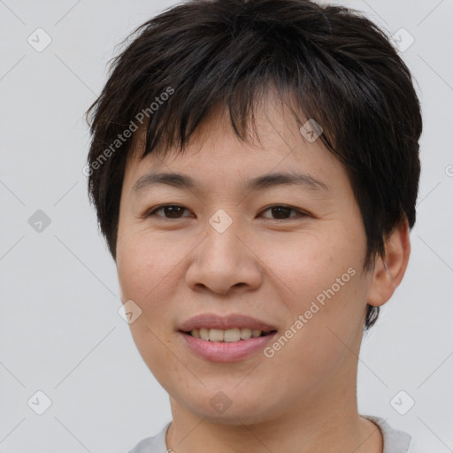 Joyful asian young-adult female with short  brown hair and brown eyes