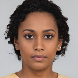 Neutral black young-adult female with short  black hair and brown eyes