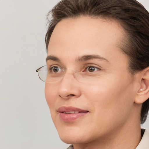 Joyful white adult female with short  brown hair and brown eyes