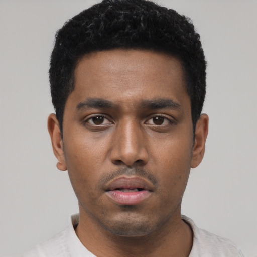 Neutral black young-adult male with short  black hair and brown eyes