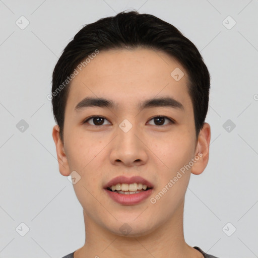 Joyful asian young-adult male with short  black hair and brown eyes