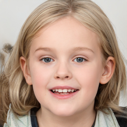 Joyful white child female with medium  brown hair and blue eyes