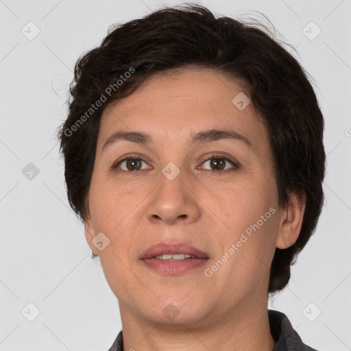 Joyful white adult female with short  brown hair and brown eyes