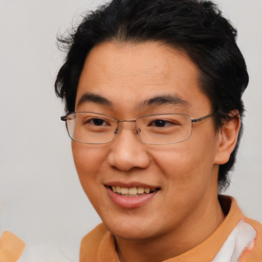 Joyful asian adult female with short  brown hair and brown eyes