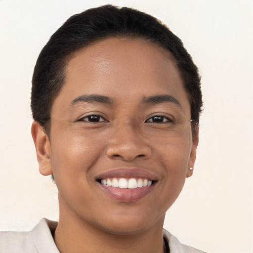 Joyful latino young-adult female with short  brown hair and brown eyes