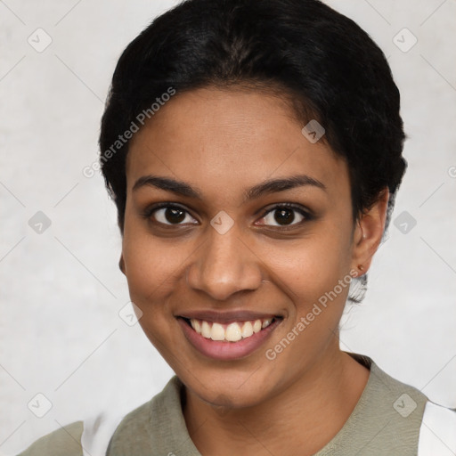 Joyful latino young-adult female with short  black hair and brown eyes