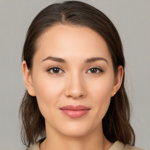 Joyful white young-adult female with medium  brown hair and brown eyes