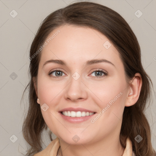 Joyful white young-adult female with medium  brown hair and grey eyes