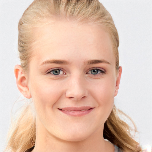 Joyful white young-adult female with long  brown hair and blue eyes