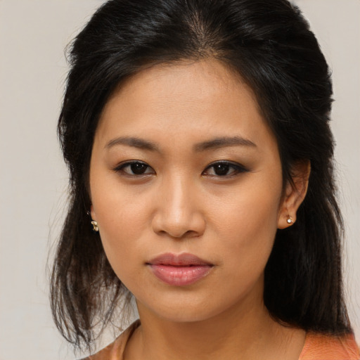 Joyful asian young-adult female with medium  brown hair and brown eyes