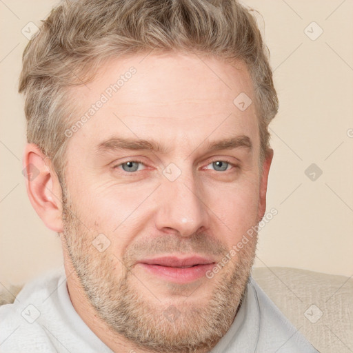 Joyful white adult male with short  brown hair and grey eyes