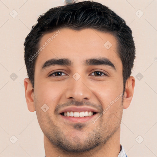 Joyful white young-adult male with short  black hair and brown eyes