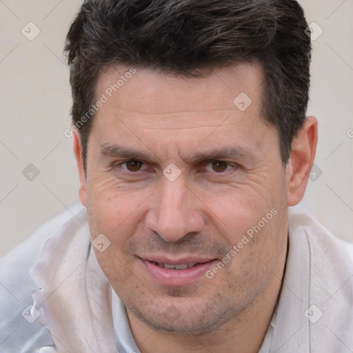 Joyful white adult male with short  brown hair and brown eyes