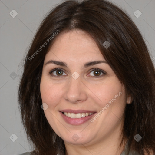 Joyful white adult female with medium  brown hair and brown eyes