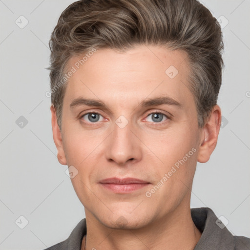 Joyful white adult male with short  brown hair and grey eyes