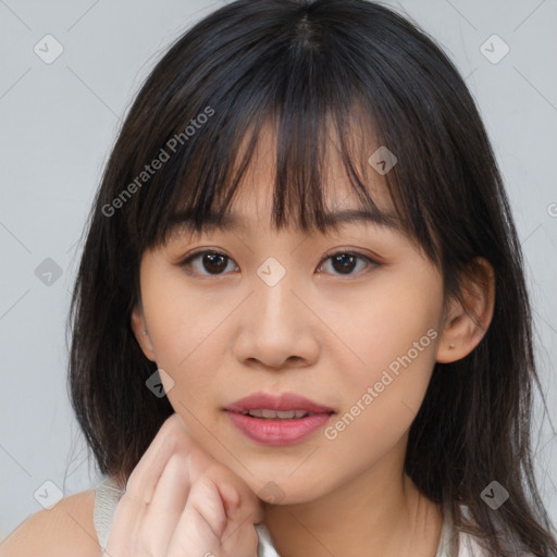 Neutral asian young-adult female with medium  brown hair and brown eyes