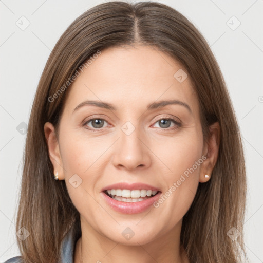 Joyful white young-adult female with long  brown hair and grey eyes