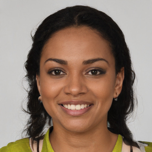 Joyful latino young-adult female with medium  black hair and brown eyes