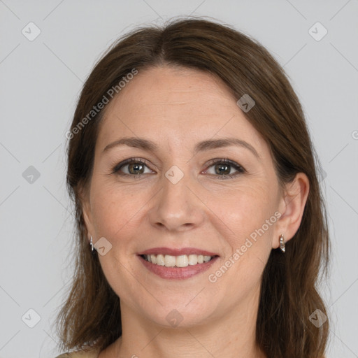 Joyful white adult female with medium  brown hair and grey eyes