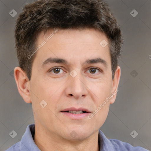 Joyful white adult male with short  brown hair and brown eyes