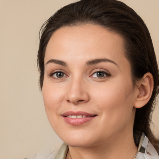 Joyful white young-adult female with medium  brown hair and brown eyes