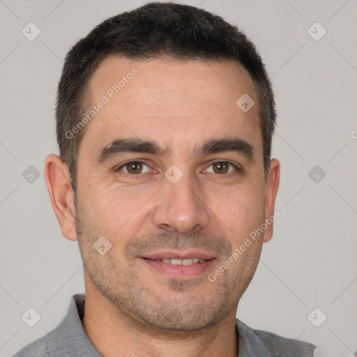 Joyful white adult male with short  brown hair and brown eyes