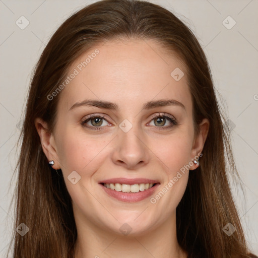 Joyful white young-adult female with long  brown hair and green eyes