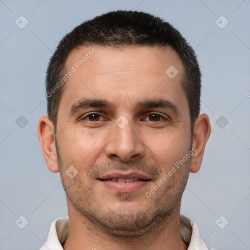 Joyful white young-adult male with short  brown hair and brown eyes