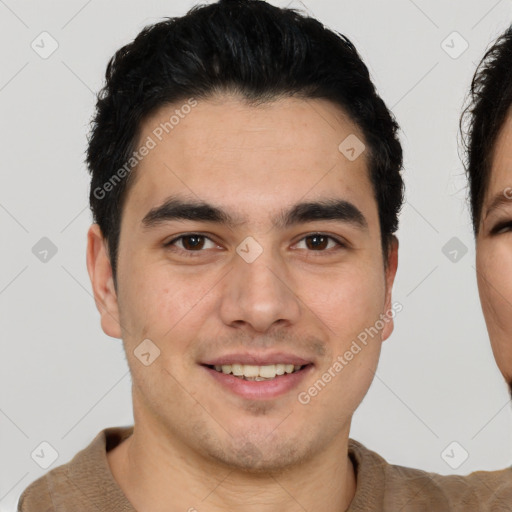 Joyful white young-adult male with short  black hair and brown eyes