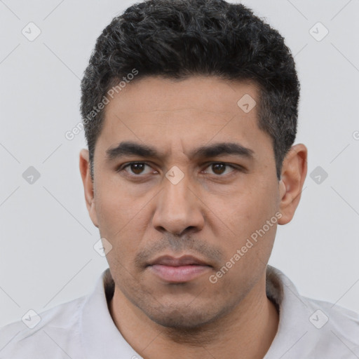 Neutral white young-adult male with short  black hair and brown eyes