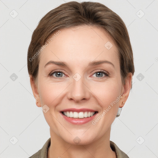 Joyful white young-adult female with short  brown hair and grey eyes