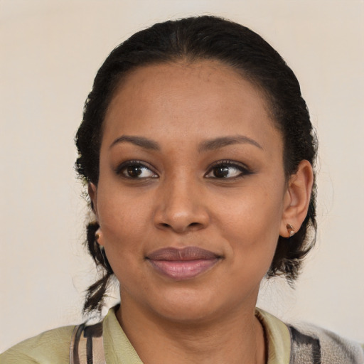 Joyful latino young-adult female with medium  brown hair and brown eyes