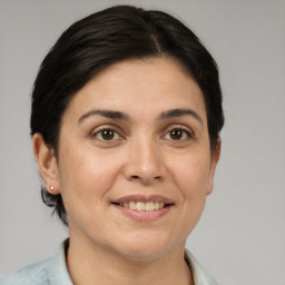 Joyful white adult female with short  brown hair and brown eyes