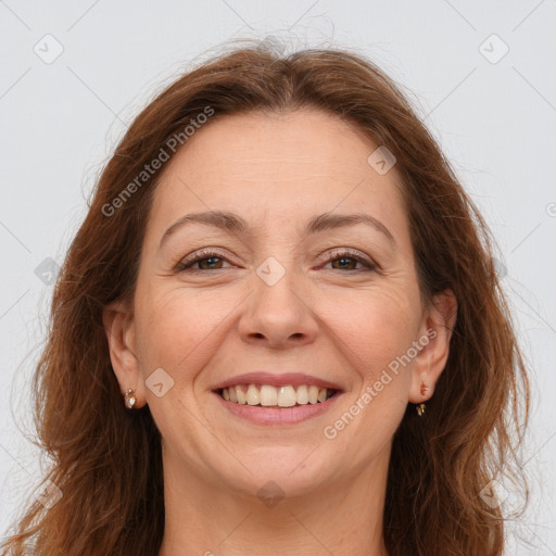 Joyful white adult female with long  brown hair and brown eyes