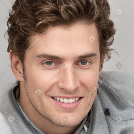 Joyful white young-adult male with short  brown hair and blue eyes