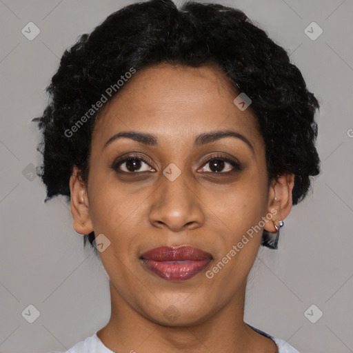 Joyful black young-adult female with short  black hair and brown eyes